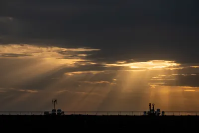 Cloudy sky, sun rays piercing through