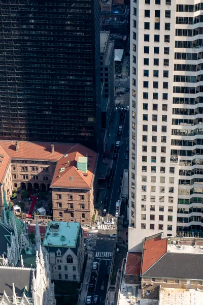 A street from above, its access barred by the city police.