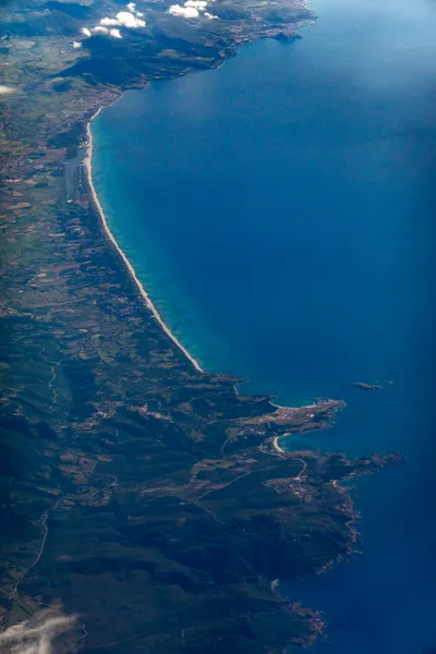 Aerial view of a coast and a long beach