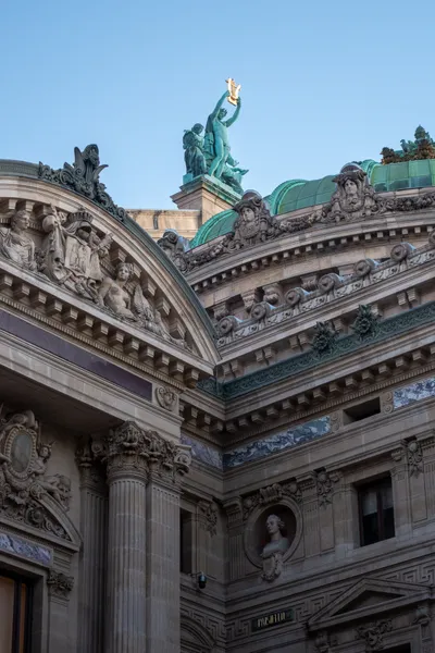 Bronze statue brandishing a gilded lyre, atop the Paris Opera