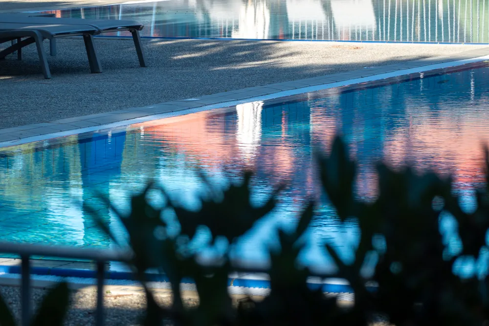 An empty pool reflecting bright colors