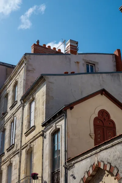 Building next to each other, seen at an angle, each one taller than the one before.